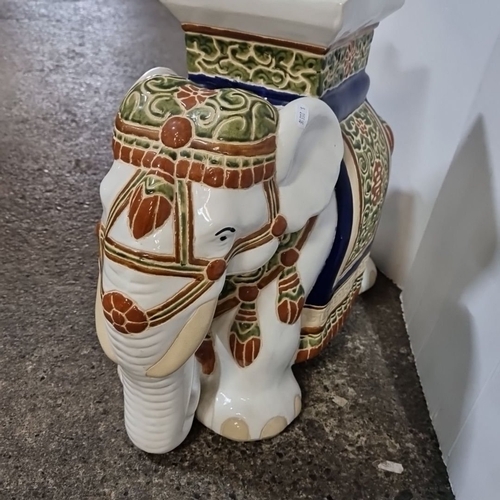 673 - Hand-painted ceramic elephant stool / Plant stand with intricate Asian-inspired patterns.