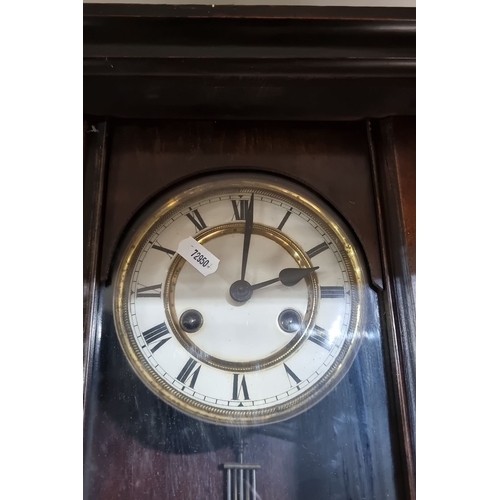 678 - 19th Century German Wall Clock, richly carved wooden case, Roman numeral dial, brass pendulum with 