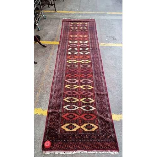 880 - Super star lot :Handwoven Persian runner rug features geometric patterns in rich reds and yellows, c... 