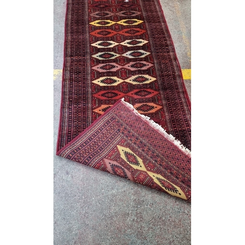 880 - Super star lot :Handwoven Persian runner rug features geometric patterns in rich reds and yellows, c... 