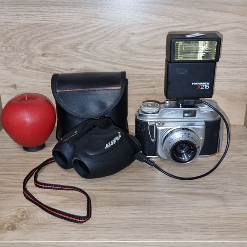 882 - Includes Agfa camera with Hanimex X215 flash, black leather case and a pair of compact binoculars.