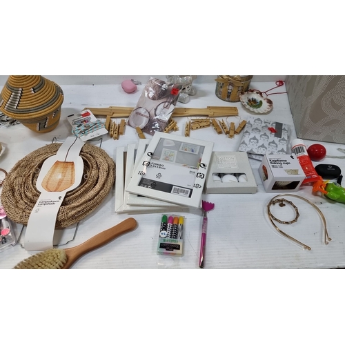 886 - Diverse household lot features a decorative woven basket, burlap lampshade, photo frames, jewelry, a... 