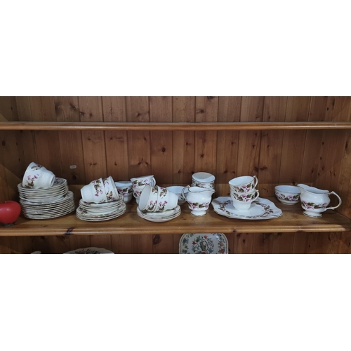 898 - A 40 piece Arklow pottery tea service featuring cups, saucers, side plates, sandwich plate, creamer ... 