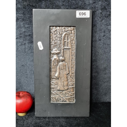 696 - A relief on metal panel. Features an ecclesiastical scene, where two monks are captured within the s... 