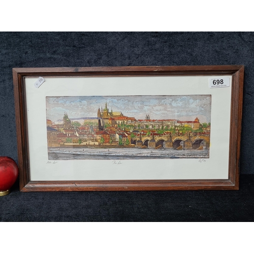 698 - A charming original hand coloured etching. Features a cityscape of Prague. Signed indistinctly. Hous... 