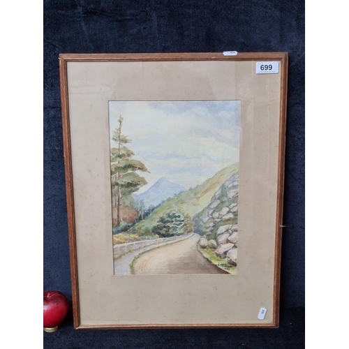 699 - An original 'L.M.Scott' watercolour on paper painting. Features a trail winding through a forest, th... 