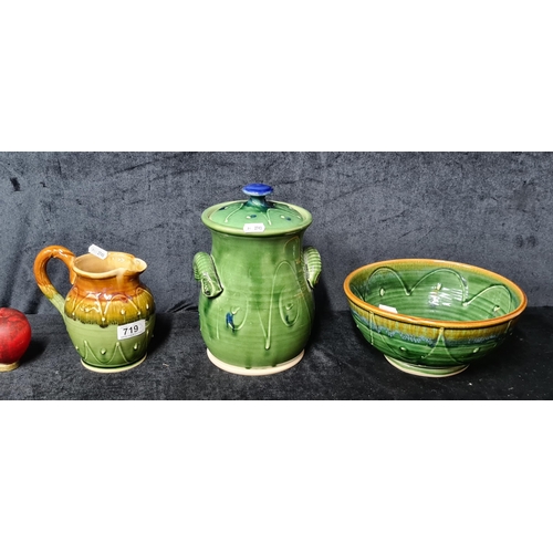 719 - Three pieces of handmade ceramics including a mixing bowl, jug and a lidded jar. All feature a rich ... 