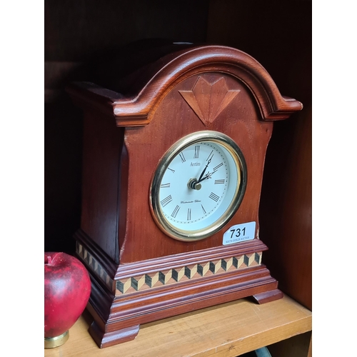 731 - A handsome Acctim battery powered mantel clock with attractive geometric inlay.