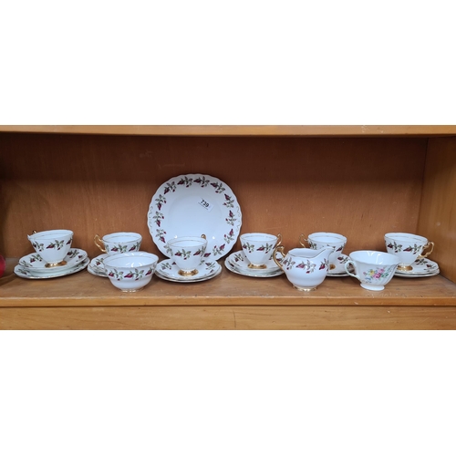 739 - A 21 piece Royal Imperial China set including cups, saucers, side plates, milk jug and sugar bowl. A... 