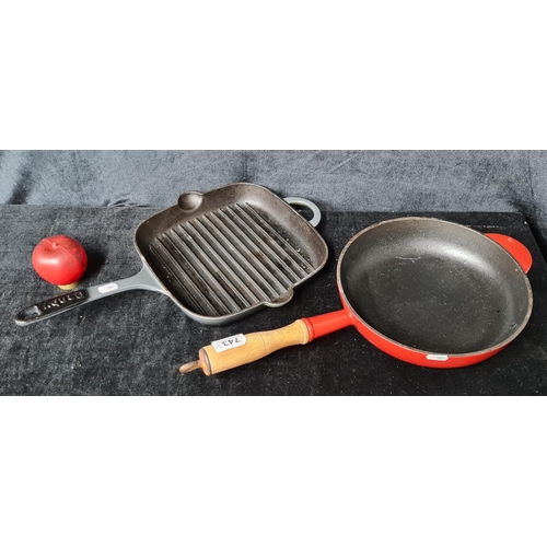 743 - Two cast iron pans including a Denby square griddle pan, and a round Crofton pan with wooden handle.