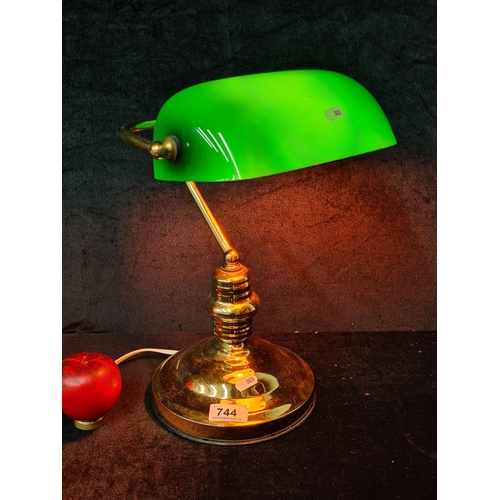 744 - A handsome bankers lamp with the classic green glass shade and brass base.