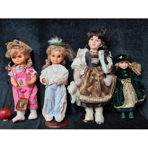 762 - A selection of dolls including some ceramic examples.