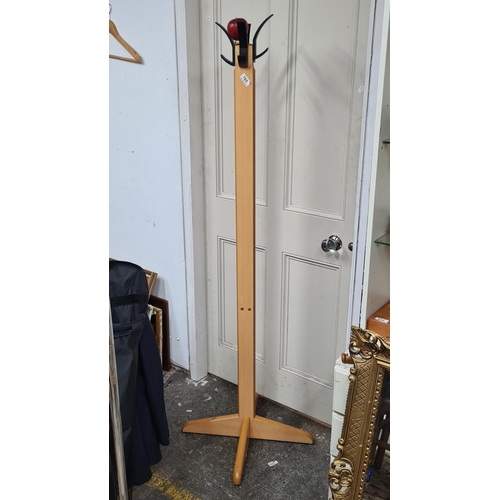 765 - A practical solid pine four branch coat/hat stand.