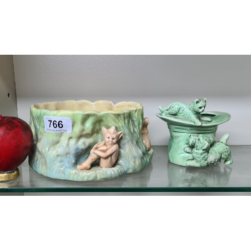 766 - Two charming pieces of vintage Sylvac pottery including a planter in the form of a tree stump.