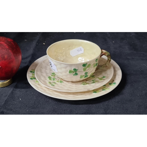 768 - Three wonderful pieces of early black stamp (1891-1926) Belleek comprising of a cup, saucer and side... 