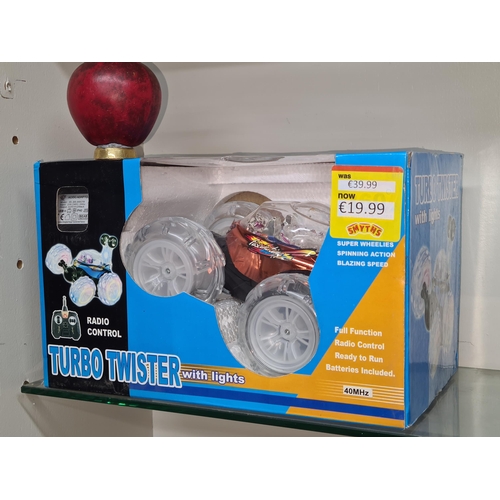 781 - A new in box radio control Turbo Twister car with lights, spinning action and blazing speed.