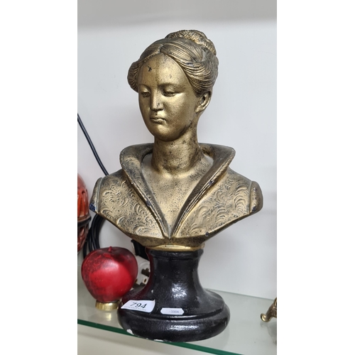 794 - A lovely bronze toned bust on ebonised baseof an elegant lady.