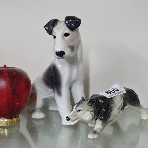 806 - A charming set of porcelain dog figurines. Both stamped see other pics.