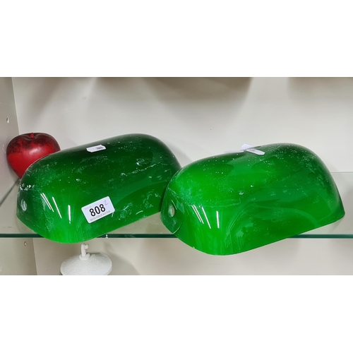 808 - A pair of hand blown green glass bankers lamp shades.