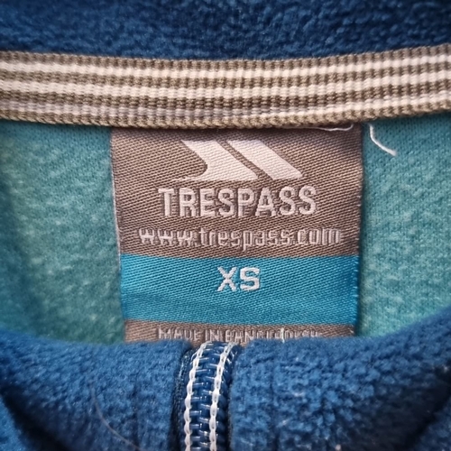 962 - Includes a turquoise fleece pullover by Trespass (XS), a textured white turtleneck, and a navy sweat... 