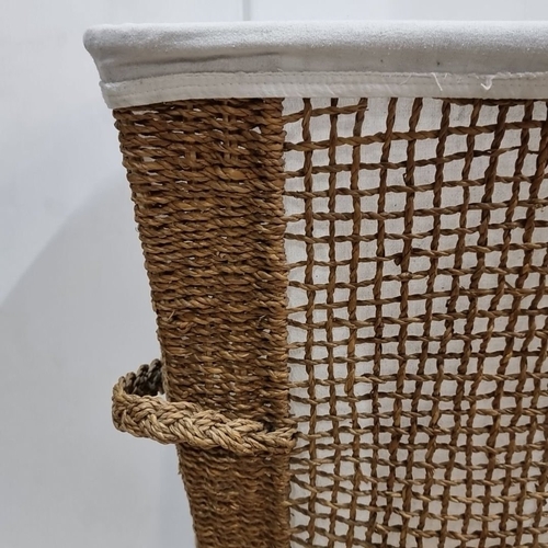 968 - A handwoven jute basket with canvas liner, complemented by a mix of six modern neutral-tone cushions... 