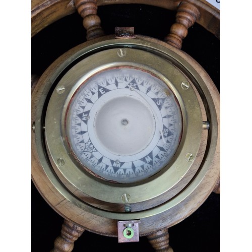 143 - Star Lot : An excellent vintage wooden ships helm with brass porthole compass to centre. Great looki... 