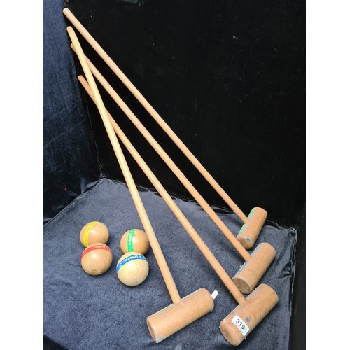 319 - A vintage croquets set with Mallets and balls etc..