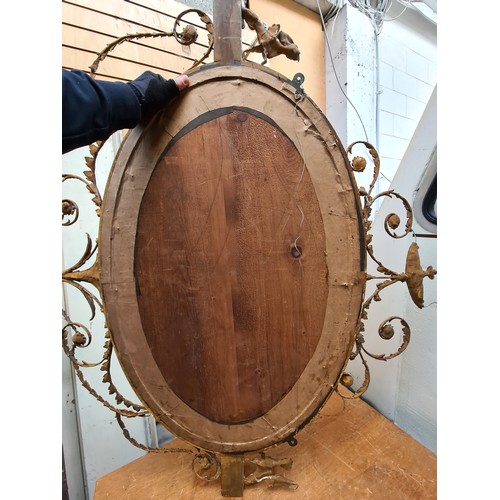 325 - Star Lot : A fabulous 19th century Empire Period oval wall mounted mirror complete with extravagant ... 