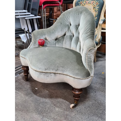 397 - Star Lot : A fabulous Victorian button back conversation chair, featuring turned frontal legs and en... 