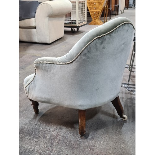 397 - Star Lot : A fabulous Victorian button back conversation chair, featuring turned frontal legs and en... 