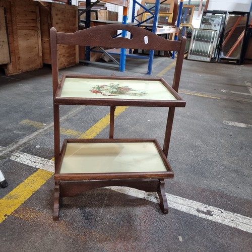 428 - A vintage folding two tier serving table.