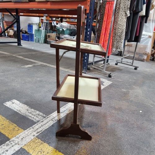 428 - A vintage folding two tier serving table.