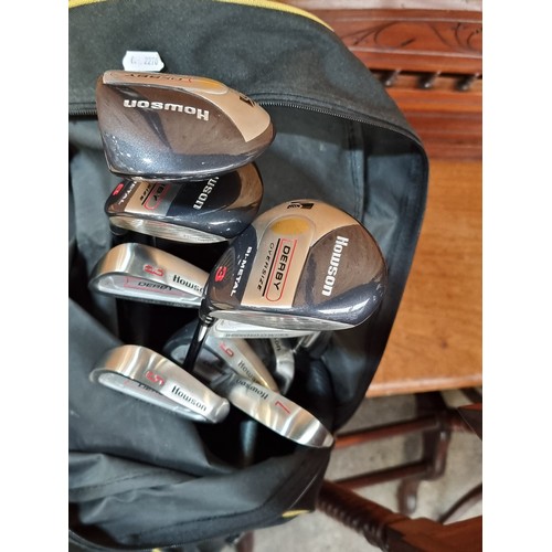 458 - An as new set of Howson golf clubs with driver, 3 wood and 5 wood, 4 to 7 clubs and sand wedge, with... 