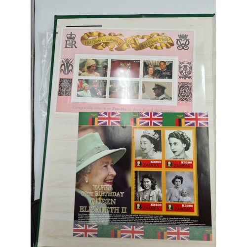 574 - A stamp album containing stamps relating to queen mother, mostly mint sets, sheets and pictorial cov... 