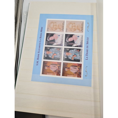 574 - A stamp album containing stamps relating to queen mother, mostly mint sets, sheets and pictorial cov... 