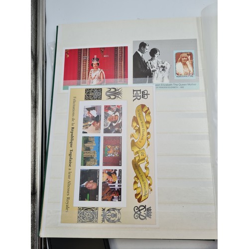 574 - A stamp album containing stamps relating to queen mother, mostly mint sets, sheets and pictorial cov... 