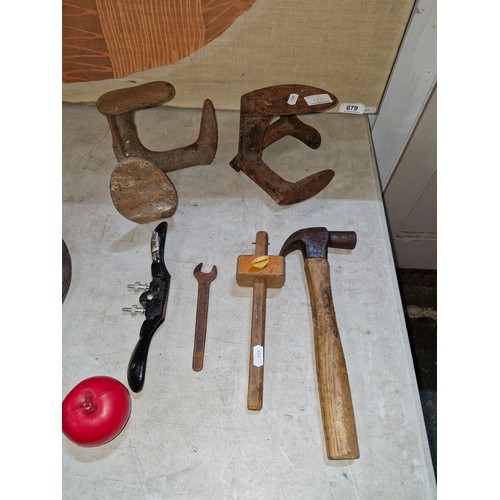 664 - A selection of antique tools including shoe lasts, spoke plane, and scribe measure.