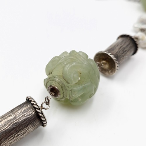 823 - Star Lot: A fabulous antique Chinese natural pearl and jade necklace with jade carved ball with a Ch... 