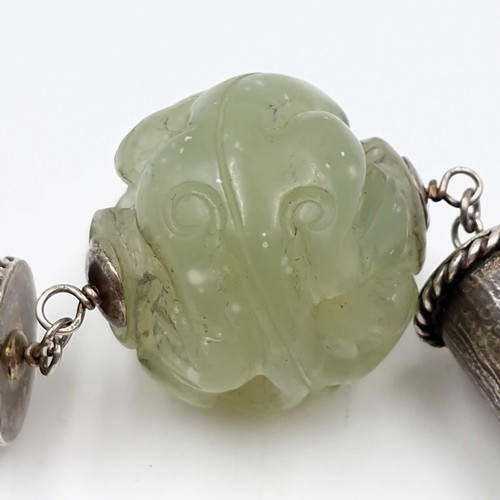 823 - Star Lot: A fabulous antique Chinese natural pearl and jade necklace with jade carved ball with a Ch... 