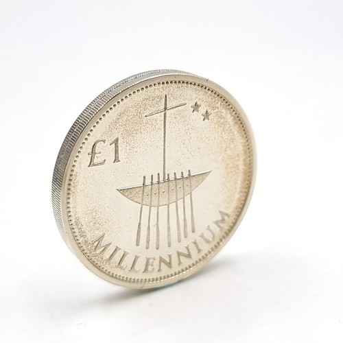 8 - A sterling silver one pound coin struck to commemorate the Millennium. Comes in original box with ce... 