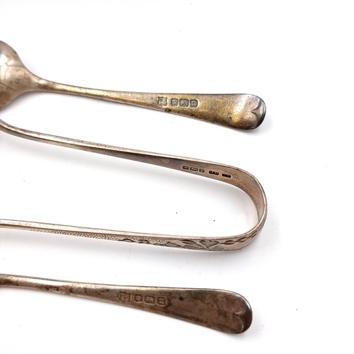 28 - A boxed collection of four silver teaspoons hallmarked Sheffield. Together with a pair of sugar tong... 