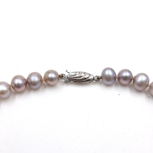 38 - A good quality cultured pearl necklace set with sterling silver clasp. Length - 48 cms.