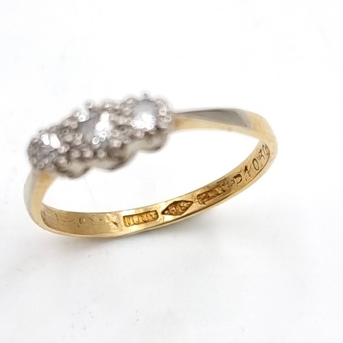 645 - Star Lot : A three stone 18 carat gold diamond ring. Size - M. Weight - 1.76 grams. Boxed.