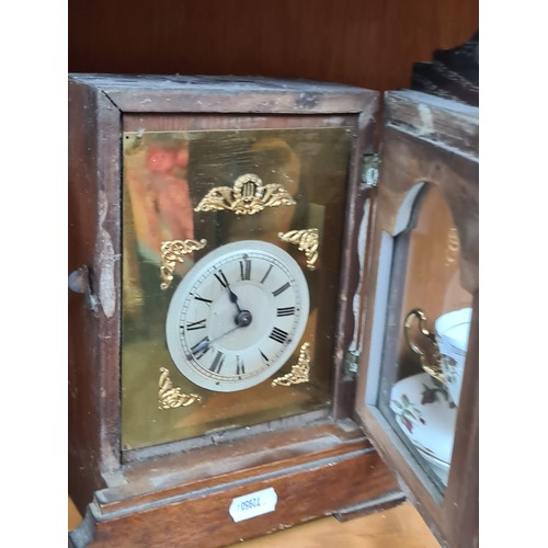 738 - A beautiful antique Irish made oak cased mantel clock. The clock face features a roman numeral dial ... 