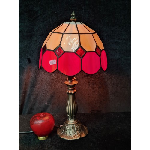 746 - A lovely Tiffany style table lamp in tones of red, black and red.