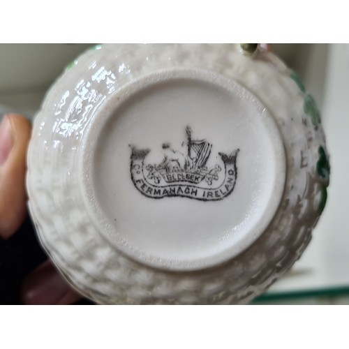 768 - Three wonderful pieces of early black stamp (1891-1926) Belleek comprising of a cup, saucer and side... 