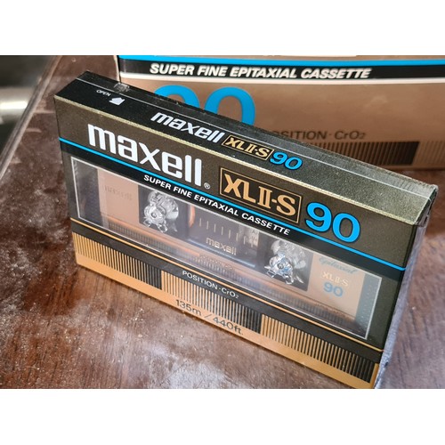 838 - A mixed lot of items. Includes Maxell XLII-S cassette tapes (5 sealed tapes), Stocks & Shares card g... 