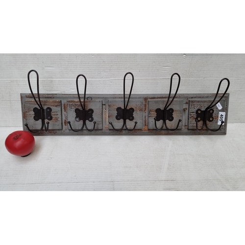 405 - Rustic wooden wall-mounted coat rack with five black metal wire double hooks. Distressed finish adds... 