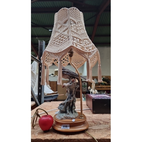 415 - A lovely Vintage table lamp with ornate macramé shade, hand-painted ceramic base depicting a bird an... 