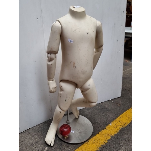 438 - Vintage articulated child mannequin from the mid-20th century, made of fiberglass or composite mater... 